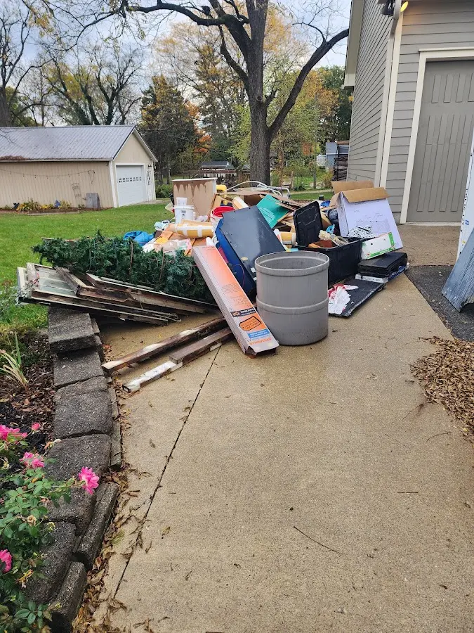 Dumpster being loaded with debris for Residential Dumpster Rental in Ridgeway